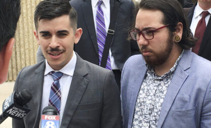 FILE - ACLU lawyer Chase Strangio, left, and plaintiff Joaquin Carcano address reporters after a hearing, June 25, 2018, in Winston-Salem, N.C., on their lawsuit challenging the law that replaced North Carolina's 