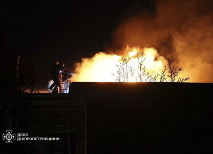 FILE - In this photo provided by the Ukrainian Emergency Services on Nov. 21, 2024, rescue workers put out a fire caused by a Russian missile strike in Dnipro, Ukraine. (Ukrainian Emergency Service via AP, File)