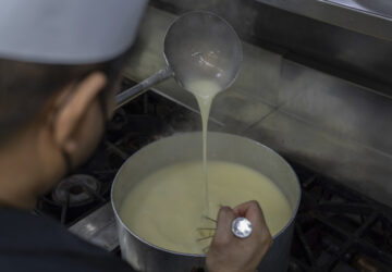 A staff member makes Caldo Verde in a kitchen at the family-run Restaurante Litoral in Macao, on Nov. 11, 2024. (AP Photo/Anthony Kwan)