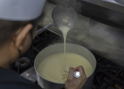 A staff member makes Caldo Verde in a kitchen at the family-run Restaurante Litoral in Macao, on Nov. 11, 2024. (AP Photo/Anthony Kwan)