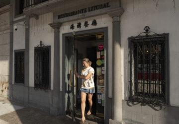 A customer exits the family-run Restaurante Litoral in Macao, on Nov. 11, 2024. (AP Photo/Anthony Kwan)