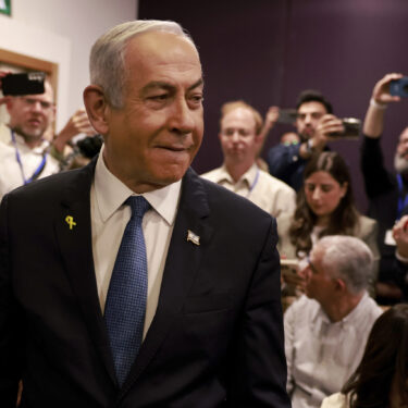 Israeli Prime Minister Benjamin Netanyahu arrives at the district court for his long-running trial for alleged corruption, in Tel Aviv, Israel, Tuesday, Dec. 10, 2024. (Menahem Kahana/Pool Photo via AP)