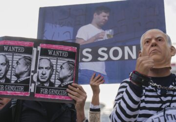 Demonstrators protest against Prime Minster Benjamin Netanyahu outside the court in Tel Aviv Tuesday Dec. 10, 2024. Netanyahu is set to take the stand on Tuesday in his long-running trial for alleged corruption.(AP Photo/Ariel Schalit)