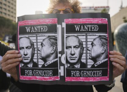 Demonstrators protest against Prime Minster Benjamin Netanyahu outside the court in Tel Aviv Tuesday Dec. 10, 2024. Netanyahu is set to take the stand on Tuesday in his long-running trial for alleged corruption.(AP Photo/Ariel Schalit)