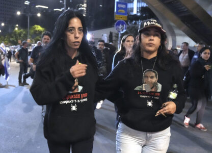 Einav Zangauker, left, mother of Israeli hostage Matan Zangauker and his partner Ilana Gritzewsky protest following a Hamas video release of Matan making an emotional plea for his release and describing the conditions he and other hostages face in Gaza after being seized in the Oct. 7 attack, in Tel Aviv, Israel, Saturday, Dec. 7, 2024. (AP Photo/Mahmoud Illean)