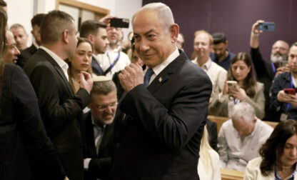 Israeli Prime Minister Benjamin Netanyahu arrives at the district court in Tel Aviv for his long-running trial for alleged corruption, in Tel Aviv, Israel, Tuesday, Dec. 10, 2024. (Menahem Kahana/Pool Photo via AP)