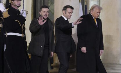 French President Emmanuel Macron, center, President-elect Donald Trump, right, and Ukraine's President Volodymyr Zelenskyy leave after their meeting at the Elysee Palace, Saturday, Dec. 7, 2024 in Paris. (AP Photo/Michel Euler)