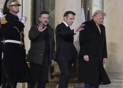 French President Emmanuel Macron, center, President-elect Donald Trump, right, and Ukraine's President Volodymyr Zelenskyy leave after their meeting at the Elysee Palace, Saturday, Dec. 7, 2024 in Paris. (AP Photo/Michel Euler)