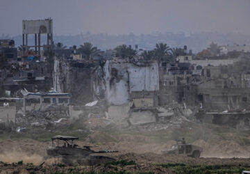 FILE - Israeli soldiers operate inside the Gaza Strip, as seen from southern Israel, Feb. 13, 2024. (AP Photo/Ariel Schalit, File)