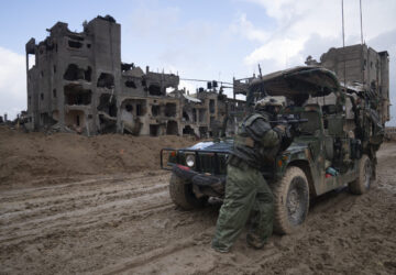 FILE - An Israeli soldier stands guard in Khan Younis, Jan. 27, 2024. (AP Photo/Sam McNeil, File)