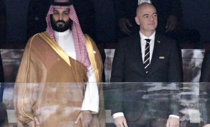 FILE - Saudi Arabia Crown Prince Mohammed bin Salman, left, and FIFA President Gianni Infantino, stand for the anthem prior to opening soccer match of the 2018 World Cup between Russia and Saudi Arabia at the Luzhniki stadium in Moscow, Russia, on June 14, 2018. (Alexei Nikolsky/Sputnik, Kremlin Pool Photo via AP, File)