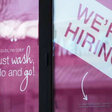 FILE - A hiring sign is displayed at a hair salon in Vernon Hills, Ill., March 28, 2023. (AP Photo/Nam Y. Huh, File)