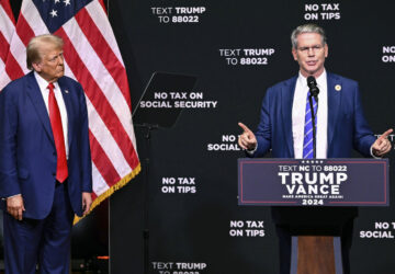 FILE - Republican presidential nominee former President Donald Trump, left, listens as investor Scott Bessent speaks on the economy in Asheville, N.C., Aug. 14, 2024. (AP Photo/Matt Kelley, File)