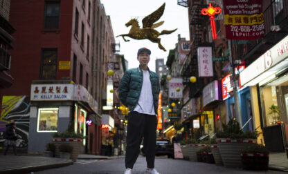 Karho Leung, 33, one of the founders of 12 Pell, a local barbershop, stands for his portrait on Pell Street in Manhattan's Chinatown neighborhood, Thursday, Jan. 25, 2024, in New York. Anchored in the Chinatown community and equally at home elsewhere in the city, Leung says he's 