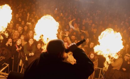 The crowd reacts to the performance of rap band PVNCH during the presentation of the music album Epoch, a collaboration between Ukrainian artists and the 3rd Assault Brigade, in Kyiv, Ukraine, Saturday, Dec. 7, 2024. (AP Photo/Alex Babenko)