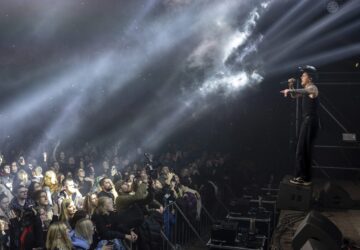 Dmytro Odnorozhenko, solo singer of punk rock band Hatespeech sings during the presentation of the music album Epoch, a collaboration between Ukrainian artists and the 3rd Assault Brigade, in Kyiv, Ukraine, Saturday, Dec. 7, 2024. (AP Photo/Alex Babenko)