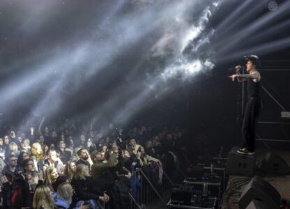 Dmytro Odnorozhenko, solo singer of punk rock band Hatespeech sings during the presentation of the music album Epoch, a collaboration between Ukrainian artists and the 3rd Assault Brigade, in Kyiv, Ukraine, Saturday, Dec. 7, 2024. (AP Photo/Alex Babenko)