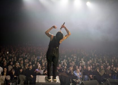 Dmytro Odnorozhenko, solo singer of punk rock band Hatespeech sings during the presentation of the music album Epoch, a collaboration between Ukrainian artists and the 3rd Assault Brigade, in Kyiv, Ukraine, Saturday, Dec. 7, 2024. (AP Photo/Alex Babenko)