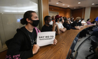 People attend a public hearing on the NOPD consent decree at Loyola Law School in New Orleans, Monday, Oct. 28, 2024. (AP Photo/Gerald Herbert)