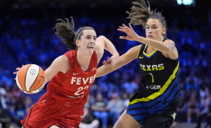 FILE- Indiana Fever guard Caitlin Clark (22) works to the basket against Dallas Wings guard Sevgi Uzun (1) in the first half of a WNBA basketball game Sunday, Sept. 1, 2024, in Arlington, Texas. (AP Photo/Tony Gutierrez, File)