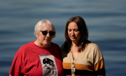 Jen Dold, whose brother, Alex Dold, lived with schizophrenia and died after a 2017 encounter with sheriff's deputies and police officers, stands for a portrait with their mother, Kathy Duncan, left, as they visit a beach he enjoyed, Wednesday, Sept. 18, 2024, in Edmonds, Wash. (AP Photo/Lindsey Wasson)