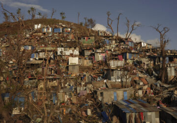 Damage is seen in the Kaweni slum Thursday, Dec. 19, 2024, on the outskirts of Mamoudzou, in the French Indian Ocean island of Mayotte, after Cyclone Chido. (AP Photo/Adrienne Surprenant)