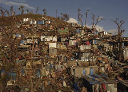 Damage is seen in the Kaweni slum Thursday, Dec. 19, 2024, on the outskirts of Mamoudzou, in the French Indian Ocean island of Mayotte, after Cyclone Chido. (AP Photo/Adrienne Surprenant)