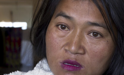 CORRECTS PLACE- A Kuki tribal woman Phalneivah Khonsai, 35, talks to Associated Press in a relief camp in Kangpokpi, Manipur, Monday, Dec. 16, 2024. Khonsai ran for her life when violence struck her neighbourhood in India's restive northeast, carrying just the bare essentials in the hope that her family would return soon. Khonsai, her husband and three children left behind their house, which was torched by a mob, and made for the hills where thousands of people from their community were heading for safety. (AP Photo/Rishi Lekhi)