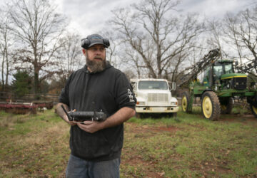 Russell Hedrick uses a DJI drone to put crop cover on his farm, Tuesday, Dec. 17, 2024, in Hickory, N.C. (AP Photo/Allison Joyce)