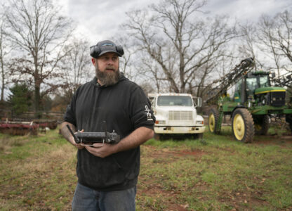 Russell Hedrick uses a DJI drone to put crop cover on his farm, Tuesday, Dec. 17, 2024, in Hickory, N.C. (AP Photo/Allison Joyce)