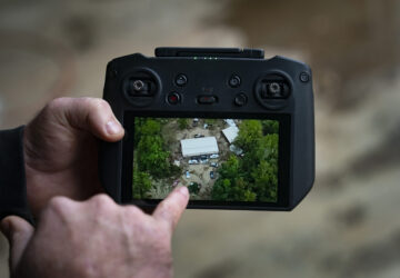 Russell Hedrick shows footage of when he used his drone to drop supplies to people during Hurricane Helene recovery, Tuesday, Dec. 17, 2024, in Hickory, N.C. (AP Photo/Allison Joyce)