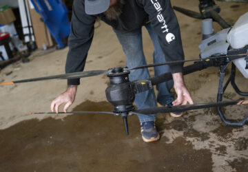 Russell Hedrick prepares a DJI drone to put crop cover on his farm, Tuesday, Dec. 17, 2024, in Hickory, N.C. (AP Photo/Allison Joyce)