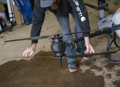 Russell Hedrick prepares a DJI drone to put crop cover on his farm, Tuesday, Dec. 17, 2024, in Hickory, N.C. (AP Photo/Allison Joyce)