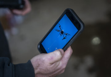 Russell Hedrick shows footage of when he used his drone to drop supplies to people during Hurricane Helene recovery, Tuesday, Dec. 17, 2024, in Hickory, N.C. (AP Photo/Allison Joyce)