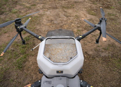 Russell Hedrick uses a DJI drone to put crop cover on his farm, Tuesday, Dec. 17, 2024, in Hickory, N.C. (AP Photo/Allison Joyce)