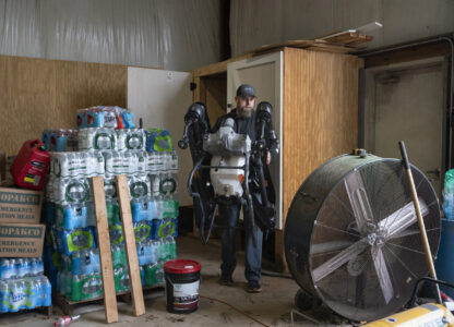 Russell Hedrick takes a DJI drone out of the closet to put crop cover on his farm, Tuesday, Dec. 17, 2024, in Hickory, N.C. (AP Photo/Allison Joyce)