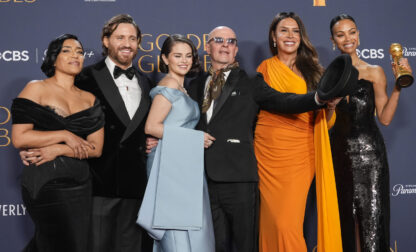 Adriana Paz, from left, Edgar Ramirez, Selena Gomez, Jacques Audiard, Karla Sofia Gascon, and Zoe Saldana pose in the press room with the award for best motion picture - musical or comedy for 