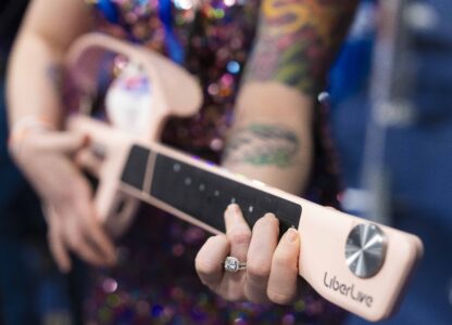 LiberLive showcases their stringless guitar at 2025 CES Unveiled, Sunday, Jan. 5, 2025, in Las Vegas. (AP Photo/Jack Dempsey)