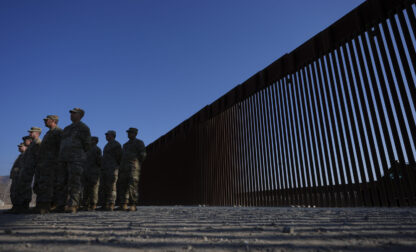 FILE - Members of the California National Guard listne during a news conference near the Otay Mesa Port of Entry along the border with Mexico, Dec. 5, 2024, in San Diego. (AP Photo/Gregory Bull, File)