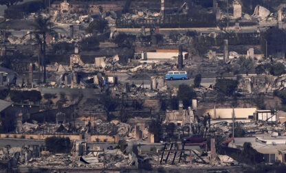 A VW van sits among burned out homes, Thursday, Jan. 9, 2025, in Malibu, Calif. (AP Photo/Mark J. Terrill)