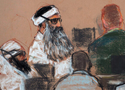 FILE - This Monday, Dec. 8, 2008 courtroom drawing by artist Janet Hamlin and reviewed by the U.S. military, shows Khalid Sheikh Mohammed, center, and co-defendant Walid Bin Attash, left, attending a pre-trial session at Guantanamo Bay Naval Base, Cuba. (AP Photo/Janet Hamlin, Pool, File)