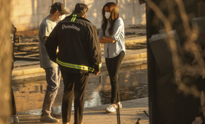 Meghan Markle, Duchess of Sussex, right, speaks with Pasadena Mayor Victor Gordo, center, and Doug Goodwin, who's home was destroyed by the Eaton Fire, in Altadena, Calif., Friday, Jan. 10, 2025. (AP Photo/Ethan Swope)