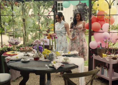 This image released by Netflix shows Meghan, Duchess of Sussex, and Mindy Kaling in a scene from her series 