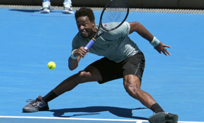 Gael Monfils of France plays a forehand return to Giovanni Mpetshi Perricard of France during their first round match at the Australian Open tennis championship in Melbourne, Australia, Tuesday, Jan. 14, 2025. (AP Photo/Asanka Brendon Ratnayake)