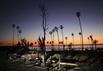 The devastation of the Palisades Fire is seen at sunset in the Pacific Palisades neighborhood of Los Angeles, Tuesday, Jan. 14, 2025. (AP Photo/Ethan Swope)