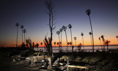 The devastation of the Palisades Fire is seen at sunset in the Pacific Palisades neighborhood of Los Angeles, Tuesday, Jan. 14, 2025. (AP Photo/Ethan Swope)