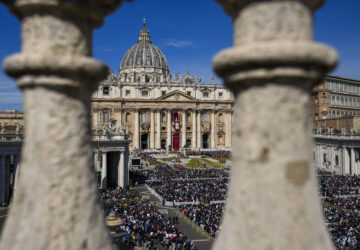 FILE - Faithful gather to attend the Catholic Easter Sunday mass led by Pope Francis in St. Peter's Square at the Vatican, April 17, 2022. (AP Photo/Alessandra Tarantino, File)