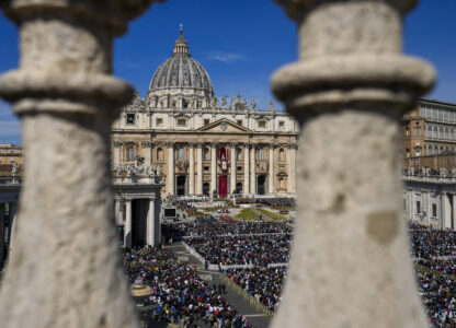 FILE - Faithful gather to attend the Catholic Easter Sunday mass led by Pope Francis in St. Peter's Square at the Vatican, April 17, 2022. (AP Photo/Alessandra Tarantino, File)