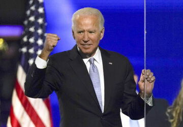 FILE - President-elect Joe Biden gestures to supporters Nov. 7, 2020, in Wilmington, Del. (AP Photo/Andrew Harnik, File)