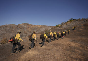 Fire crews work the burn zone of the Palisades Fire in Mandeville Canyon Thursday, Jan. 16, 2025, in Los Angeles. (AP Photo/Jae C. Hong)